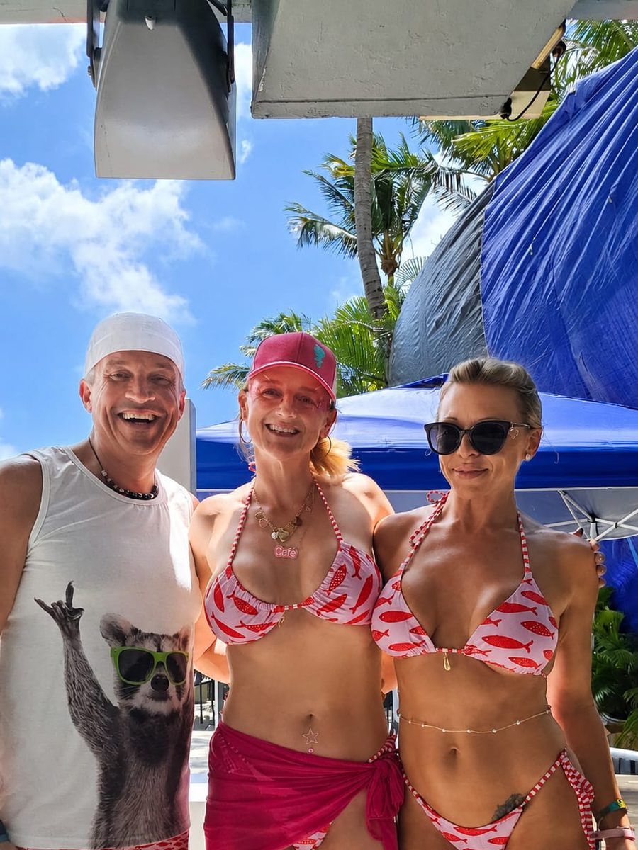 Libertine Events founder Cate with hosts Mickey and Mallory poolside at the Miami swingers hotel takeover
