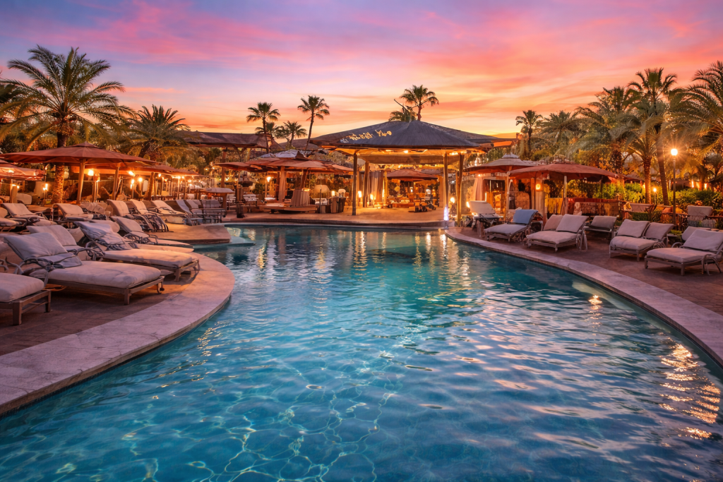 Couple enjoying a luxury lifestyle hotel takeover experience at a resort pool